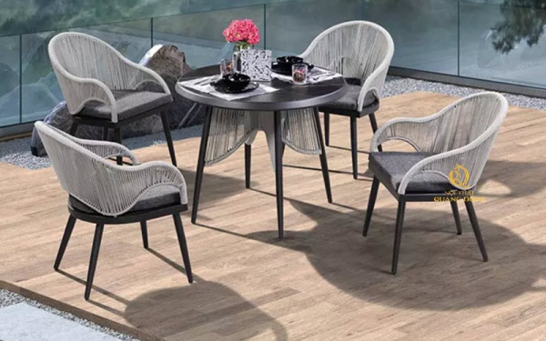 Mẫu bàn ghế sân vườn với thiết kế uốn cong tạo dáng nghệ thuật bằng sợi dây dù chắc chắn